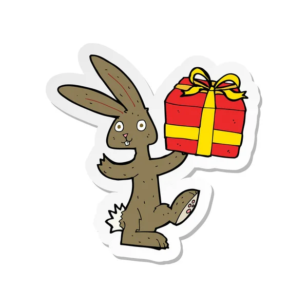 Noel hediyesi bir karikatür tavşan çıkartması — Stok Vektör