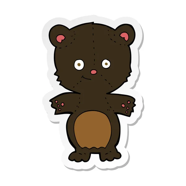 Sticker of a cartoon black bear cub — Stock Vector