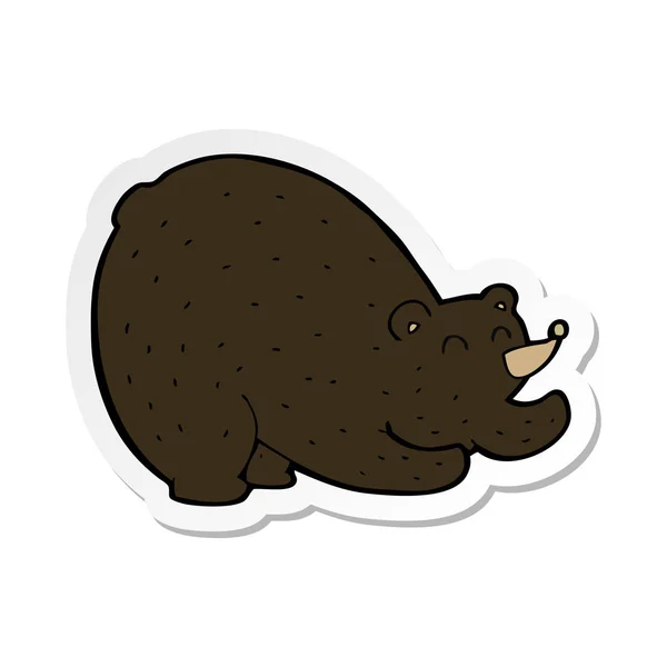 Sticker of a cartoon stretching black bear — Stock Vector