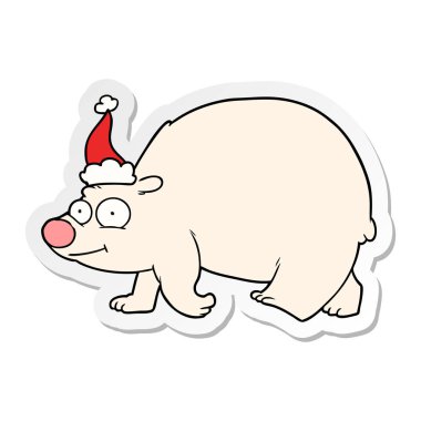Noel Baba şapkası giyen yürüyen bir kutup ayısı etiketi karikatür