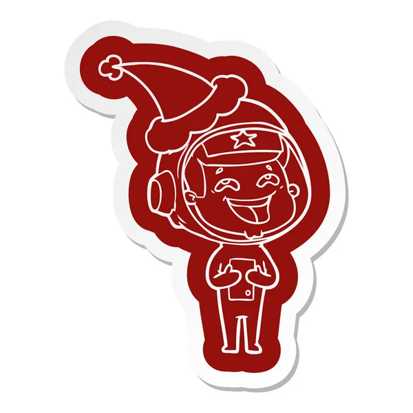 Cartoon klistermärke av en skrattande astronaut santa hatt — Stock vektor