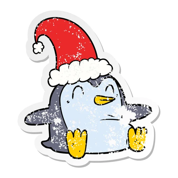 Autocollant affligé d'un pingouin dessin animé portant un chapeau de Noël — Image vectorielle