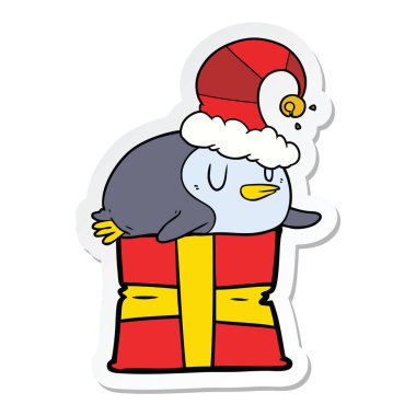 etiket Noel şapka giymiş bir karikatür penguen