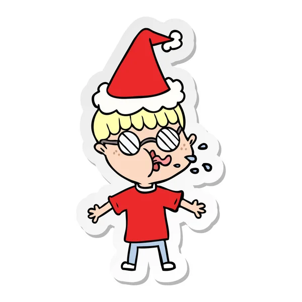 Autocollant dessin animé d'un garçon portant des lunettes portant un chapeau de Père Noël — Image vectorielle