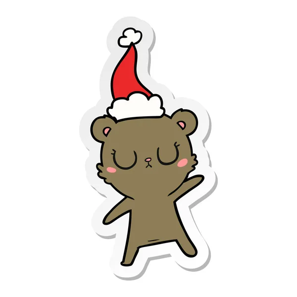 Autocollant paisible dessin animé d'un ours portant un chapeau de Père Noël — Image vectorielle