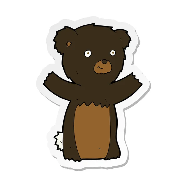 Sticker of a cartoon black bear cub — Stock Vector