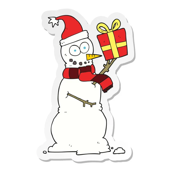 Naklejki cartoon Snowman trzyma obecny — Wektor stockowy