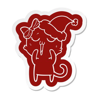 Noel Baba şapkası giyen bir kedi çizgi film etiketi