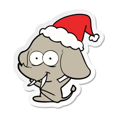 mutlu etiket karikatür Noel Baba şapkası giyen bir fil