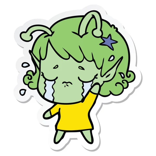 Etiqueta de um desenho animado chorando menina alienígena — Vetor de Stock