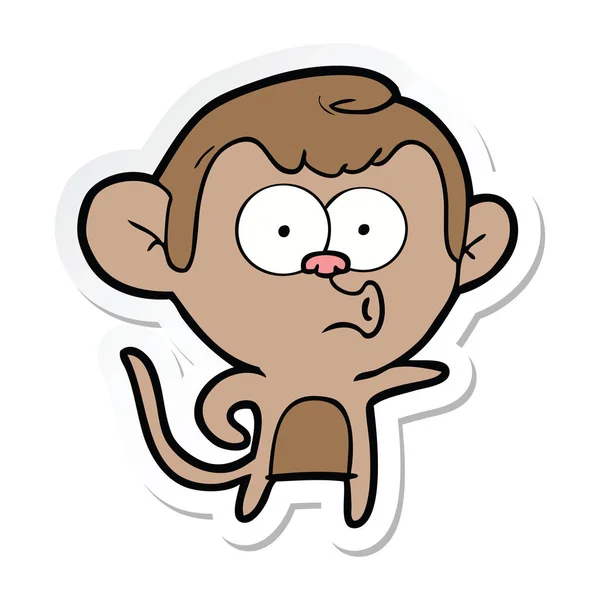 Sticker of a cartoon pointing monkey — Stock Vector