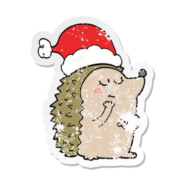 Noel şapka giymiş bir karikatür kirpi sıkıntılı etiket