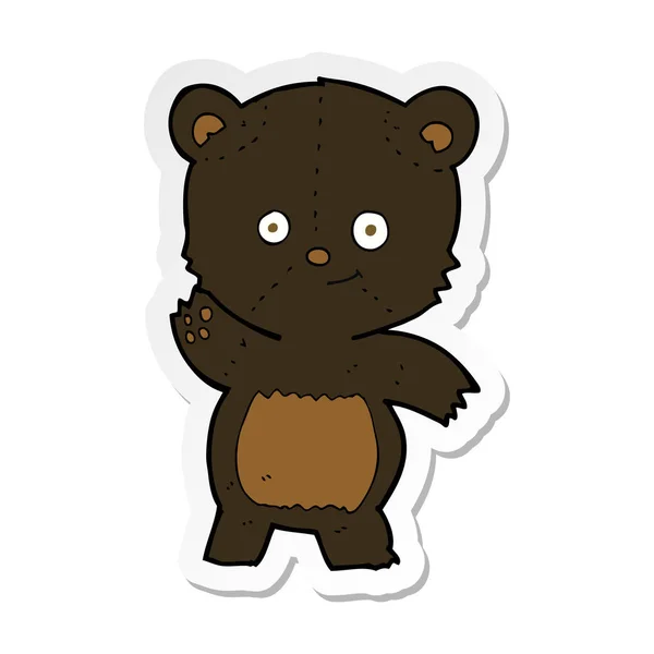 Sticker of a cartoon waving black bear — Stock Vector