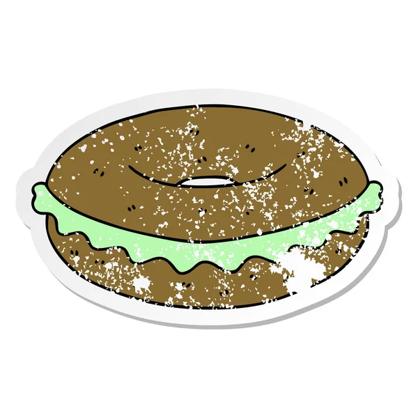 Autocollant affligé d'un bagel dessin animé dessiné à la main bizarre — Image vectorielle