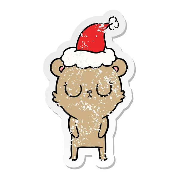 Friedliche verzweifelte Aufkleber Karikatur eines Bären mit Weihnachtsmütze — Stockvektor