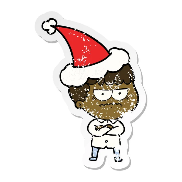 Hand Drawn Distressed Sticker Cartoon Annoyed Man Wearing Santa Hat — Stock Vector