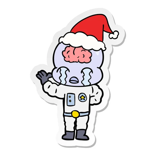 Aufkleber Karikatur eines großen Gehirnfremden weinend mit Weihnachtsmütze — Stockvektor