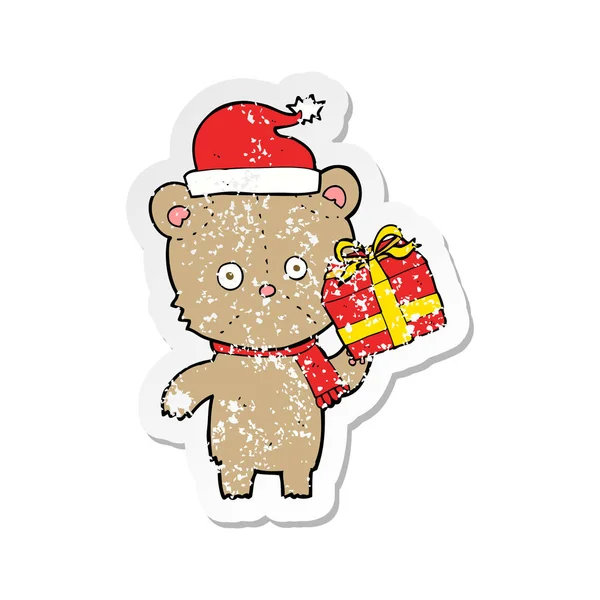 Retro Aufkleber Eines Cartoon Weihnachts Teddybären Mit Geschenk — Stockvektor
