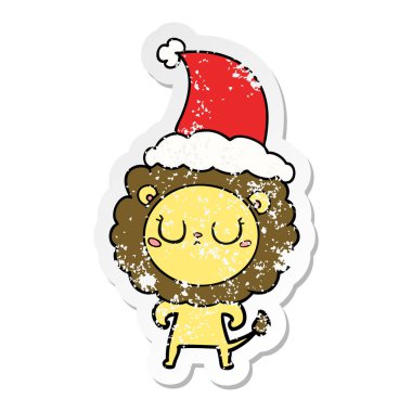 sıkıntılı etiket karikatür Noel Baba şapkası giyen aslan el çekilmiş