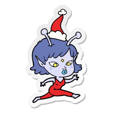 güzel etiket karikatür giyen Noel Baba şapkası çalıştıran bir uzaylı kız