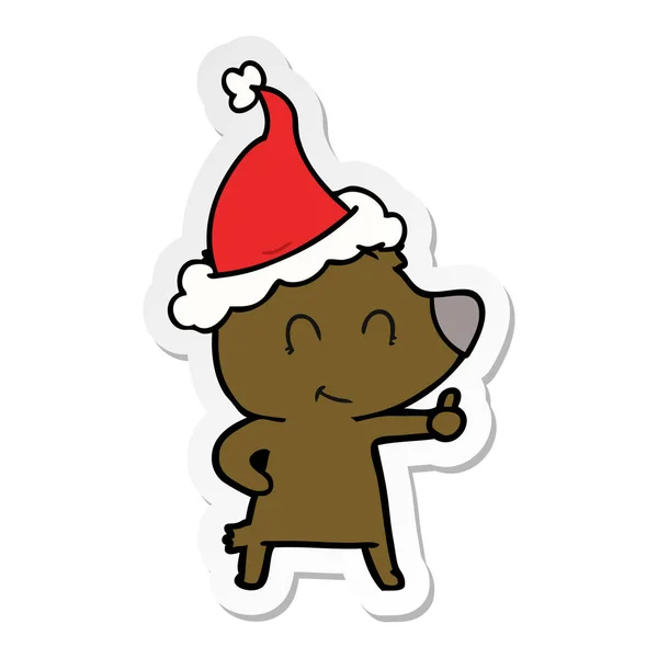 Female bear sticker cartoon of a wearing santa hat — Stock Vector