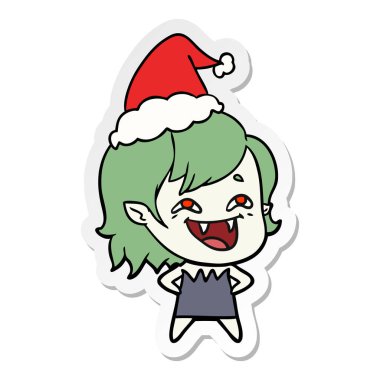 etiket karikatür Noel Baba şapkası giyen gülünecek bir vampir kız el çekilmiş