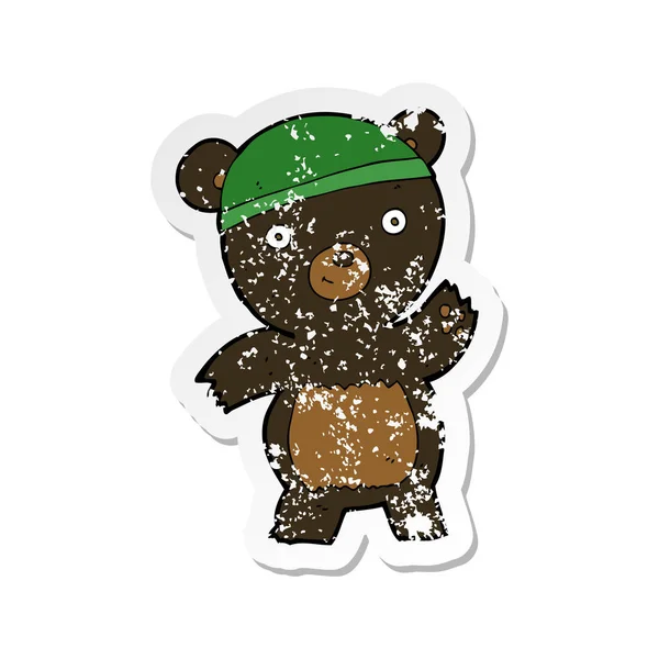 Retro angustiado pegatina de un lindo oso negro de dibujos animados — Vector de stock