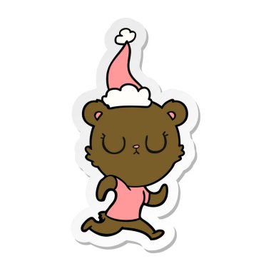 huzurlu etiket karikatür giyen Noel Baba şapkası çalıştıran bir ayının