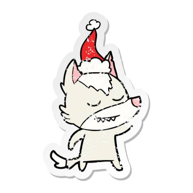 sıkıntılı etiket karikatür Noel Baba şapkası giyen bir kurt dostu el çekilmiş