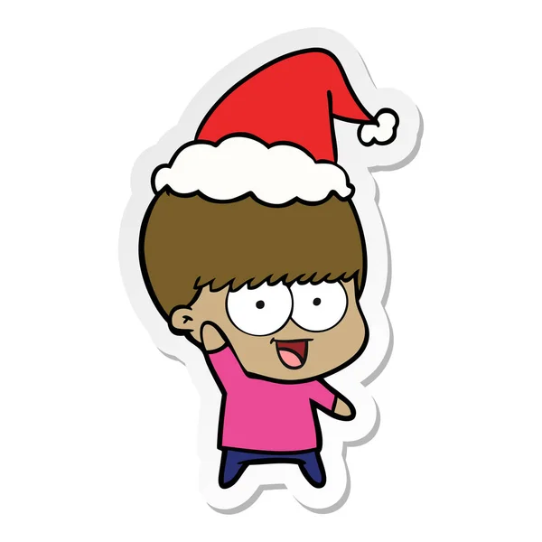 Gelukkig sticker cartoon van een jongen die zwaaien dragen KERSTMUTS — Stockvector