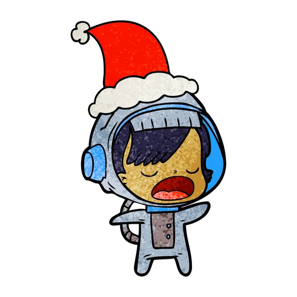 Texturierte Karikatur einer sprechenden Astronautin mit Weihnachtsmütze — Stockvektor