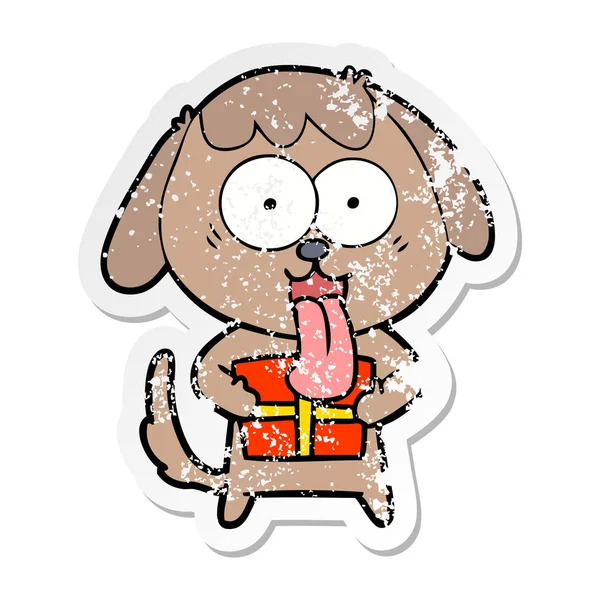 Nödställda klistermärke av en gullig tecknad hund med julklapp — Stock vektor