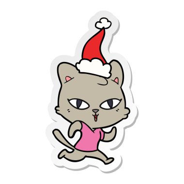 bir kediyi dışarı çalışma giyen Noel Baba şapkası için etiket karikatür el çekilmiş