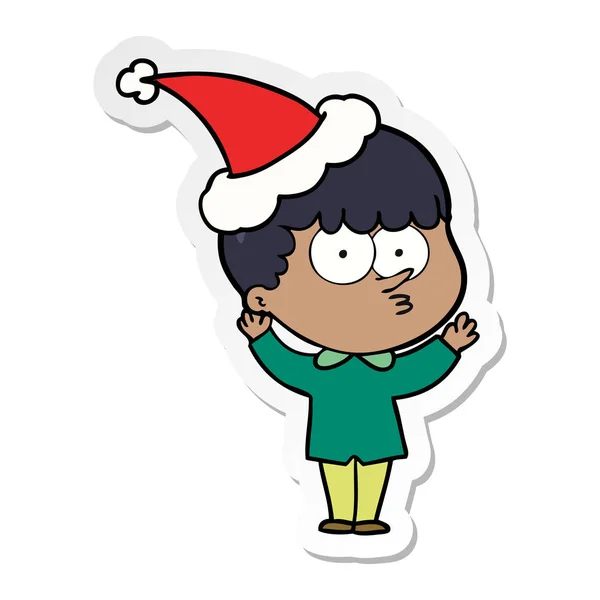 산타 모자를 쓰고 호기심 소년의 스티커 만화 — 스톡 벡터