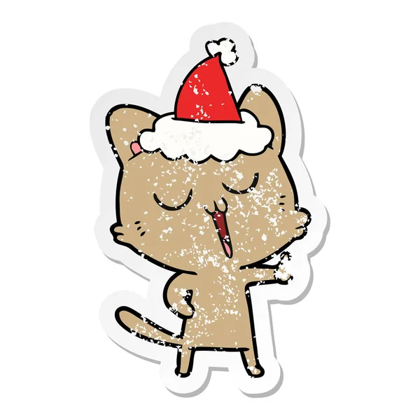 Hand Drawn Distressed Sticker Cartoon Cat Singing Wearing Santa Hat — Stock Vector