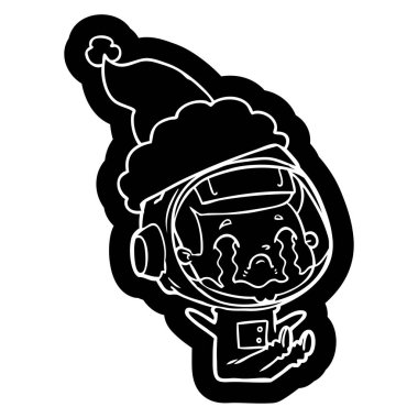 Noel Baba şapkası giyen ağlayan bir astronotun ilginç çizgi film simgesi