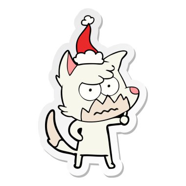 etiket karikatür Noel Baba şapkası giyen rahatsız tilki el çekilmiş