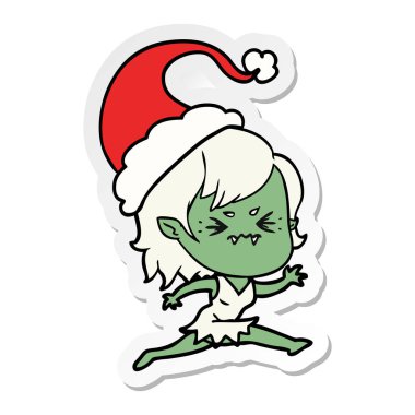 etiket karikatür Noel Baba şapkası giyen bir vampir kız rahatsız el çekilmiş