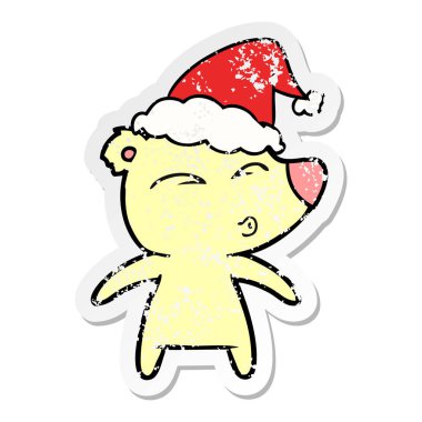 sıkıntılı etiket karikatür Noel Baba şapkası giyen bir ıslık ayının el çekilmiş