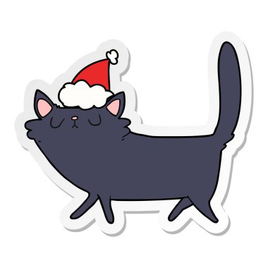 etiket karikatür santa şapka siyah bir kedi el çekilmiş