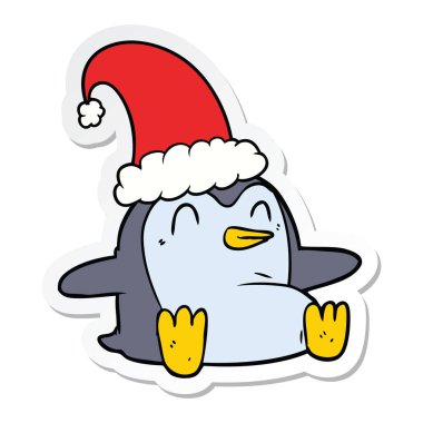 etiket Noel şapka giymiş bir karikatür penguen
