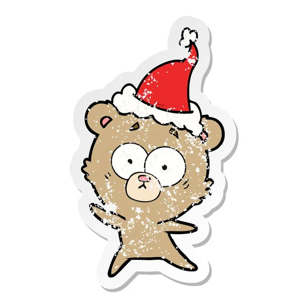 Anxious bear distressed sticker cartoon of a wearing santa hat — Stock Vector