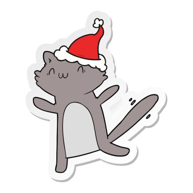 etiket karikatür Noel Baba şapkası giyen bir dans eden kedi