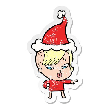 sıkıntılı etiket karikatür sürpriz bir kızın giyen Noel Baba şapkası işaret eden el çekilmiş