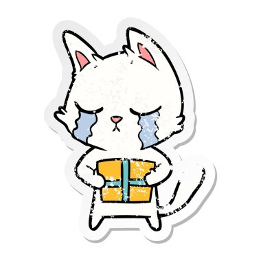 Noel hediyesi tutan ağlayan bir karikatür kedi sıkıntılı etiket