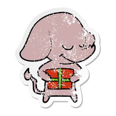 sıkıntılı etiket fil hediye ile gülümseyen bir karikatür