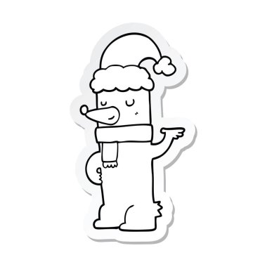 Noel şapka giymiş bir karikatür ayının etiket