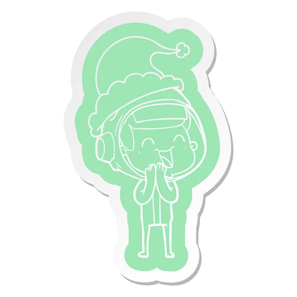 Happy cartoon  sticker of a astronaut wearing santa hat — Stock Vector