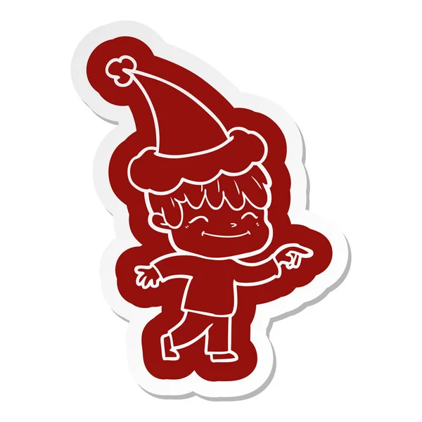 Karikatur eines glücklichen Jungen mit Weihnachtsmütze — Stockvektor