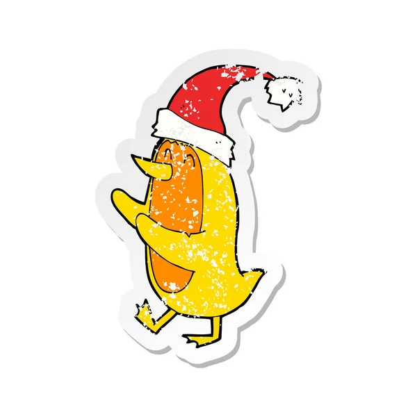 Retro Distressed Sticker Cartoon Bird Wearing Xmas Hat — Stock Vector